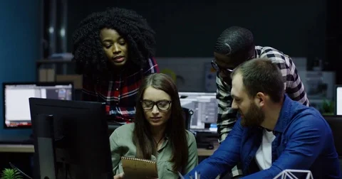 Multi ethnical business team of young office workers discussing and giving Stock Footage 82447609