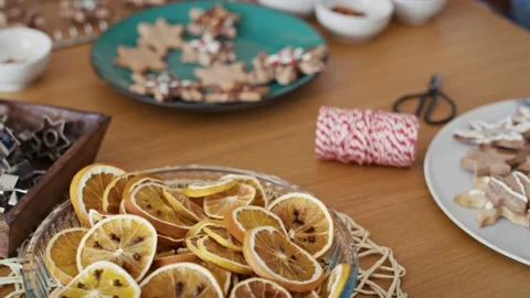 Multi ethnicity couple decorating sweet cookies at home during the Christmas Stock Footage 218780348