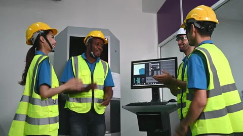 Multi ethnicity engineer and workers working Stock Footage 153299004