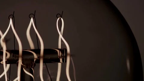 Multi filament edison bulb glows bright then fades out Stock Footage 329657310