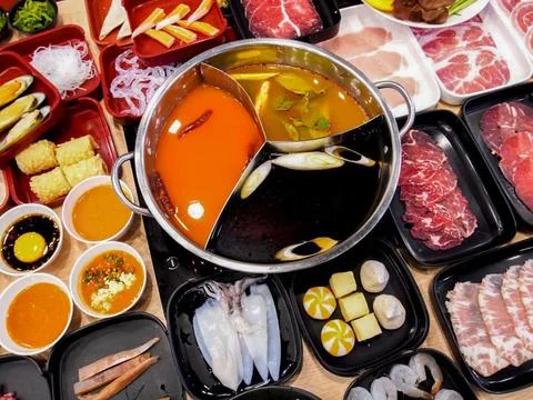 Multi-Flavor Hot Pot with Beef, Pork, Seafood and Vegetables Stock Photos