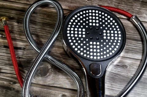 Multi-function handheld shower head with a flexible stainless steel hose, d.. Stock Photos