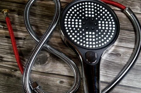Multi-function handheld shower head with a flexible stainless steel hose, d.. Stock Photos