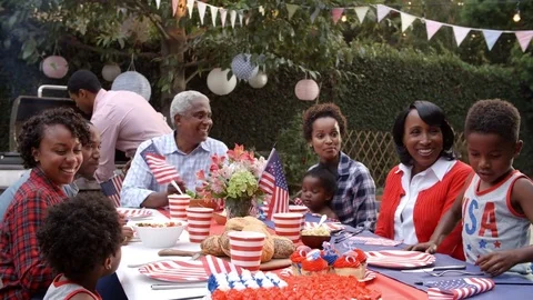 Multi generation black family talking at 4th July barbecue Stock-Footage 72511617