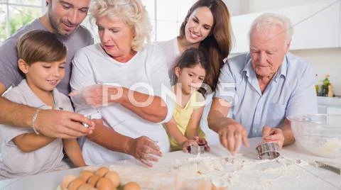 Multi-generation family baking together Stock Photos