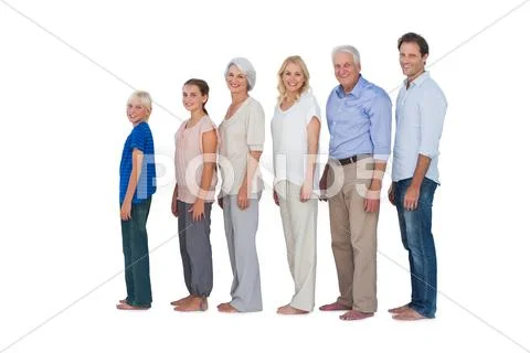 Multi-generation family posing together and looking at camera Stock Photos