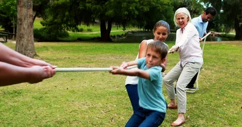 Multi-generation family pulling a rope i... | Stock Video | Pond5