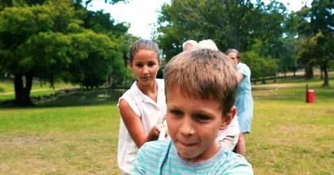 Multi-generation family pulling a rope i... | Stock Video | Pond5