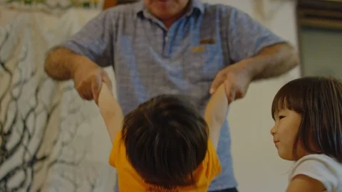 Multi-generation family serving and eating food at home. Stock Footage 100843473