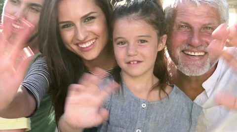 Multi Generation Family Standing Outdoors And Waving Stock Footage