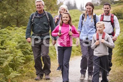 Multi generation family walking in the countryside during a camping holiday,f Stock Photos