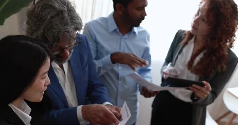 Multi generational business people working inside bank office Vidéo 172538240