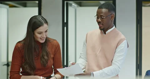 Multi generational, colleagues collaborate on a project deadline, jointly Stock Footage 262479560