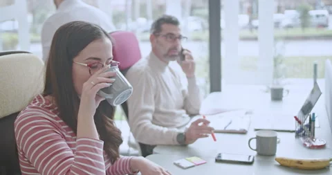 Multi generational, dedicated employees engaged in teamwork, using digital Stock Footage 273494939