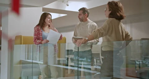 Multi generational group of businesspeople engaged in a strategic meeting Stock Footage 273812499