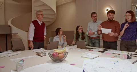 Multi generational, multicultural team of business workers engaging in a Stock Footage 274172273