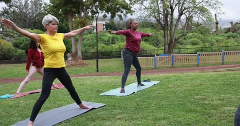 Multi generational people doing yoga exercise Stock Footage 151682485