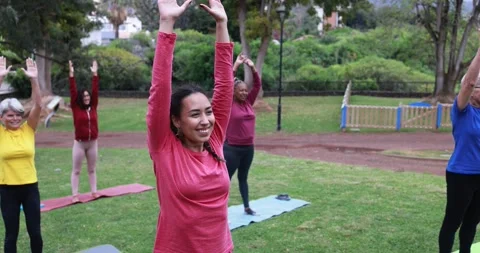 Multi generational people doing yoga class outdoor at park Stock Footage 151682867