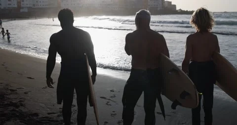 Multi generational surfer men on the beach - Multiracial people Stock Footage 151685601