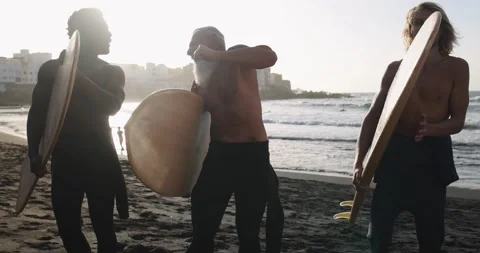 Multi generational surfer men dancing on the beach Stock Footage 151685162