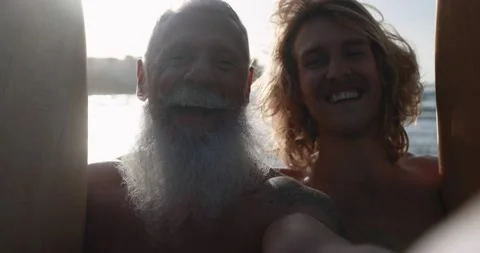 Multi generational surfer men doing video Stock Footage 151685379