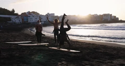 Multi generational surfer people doing warm up at the beach Vídeos de archivo 151685254