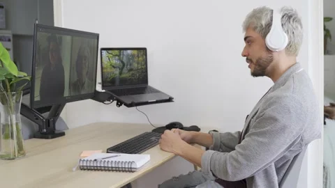 Multi generational team doing video call meeting with colleagues Stock Footage 168251042