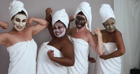 Multi generational women having fun wearing facial beauty mask Stock Footage 157005192