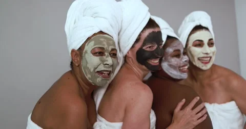 Multi generational women having fun wearing facial beauty mask Video stock 157005203