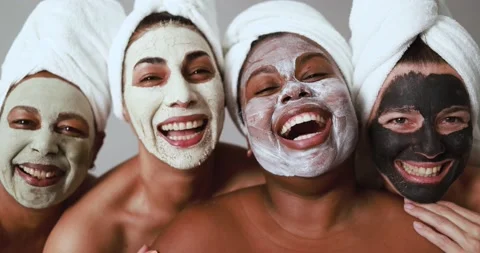 Multi generational women having fun wearing facial beauty mask Stock Footage 157005227
