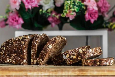 Multi grain board close up - Image. Black bread sliced ??on the background of Stock Photos