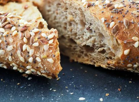 Multi-grain bread sprinkled with seeds. macro photography Stock Photos