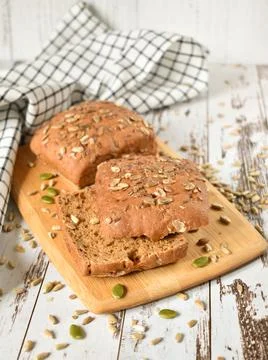 Multi - grain bread on wooden background Stock Photos