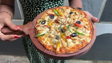Multi grain prawn pizza with extra cheese kept in a wooden board Stock-Footage 316873517