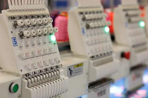 Multi head automatic embroidery machine close up Stock Photos