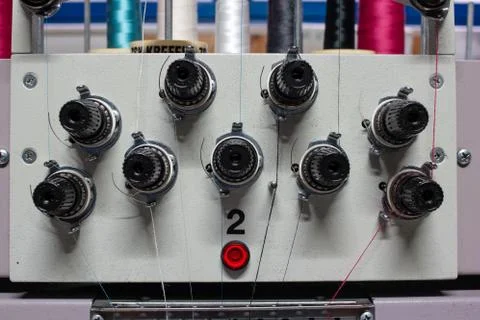 Multi head industrial sewing machine close up view inside small out of busine 스톡 사진