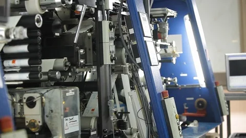 Multi Label Printing Rolls with High speed labeling machine in industrial Stock Footage 110771806