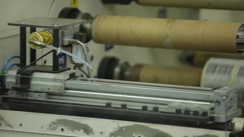 Multi Label Printing Rolls with High speed labeling machine in industrial Stock Footage 110771889
