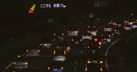 Multi-lane car traffic at night. Traffic jam. Slow motion. Stock Footage 167872852
