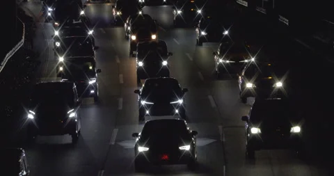 Multi-lane car traffic at night. Flow of car headlight. Stock Footage 167873078