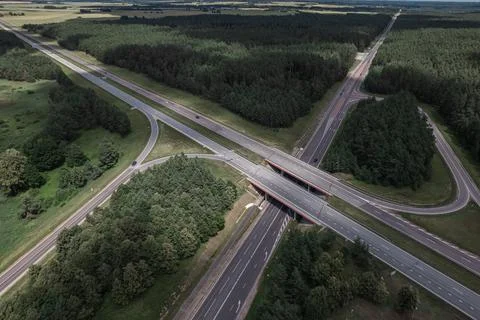 Multi-lane highway bridges over road in the countryside Stock Photos
