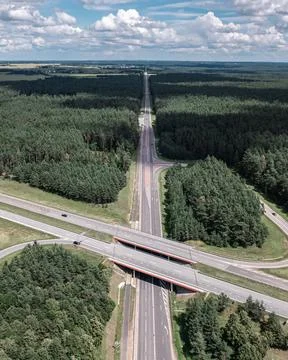Multi-lane highway bridges over road in the countryside Stock Photos