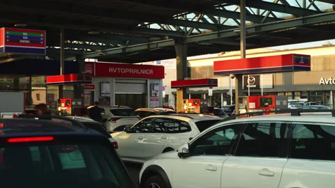 Multi-Lane Queue Approaching Service Station Stock Footage 332588391