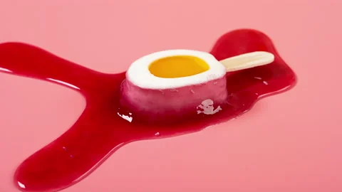 Multi-layer and multi-color popsicle melting timelapse on a pink background Stock Footage 197509296