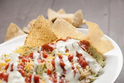 Multi-Layer Dip with Corn Tortilla Chips horizontal shot Stock Photos