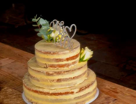 Multi-layer wedding cake without border with white roses from the side above  Stock Photos
