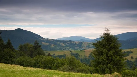 Multi-Layered Clouds over Forested Mountains. Time Lapse 4K 스톡 동영상 106458863