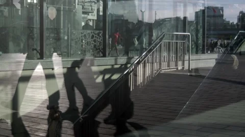 Multi-layered Images of pedestrians reflected in the window. Stock Footage 289197865