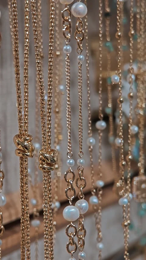 Multi layered necklaces with white pearls on display stand. Classic women Stock Footage 330788471