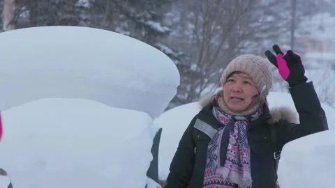 Multi lens filming of the playful process of tourists in the snow countrysid. Stock Footage 256968186